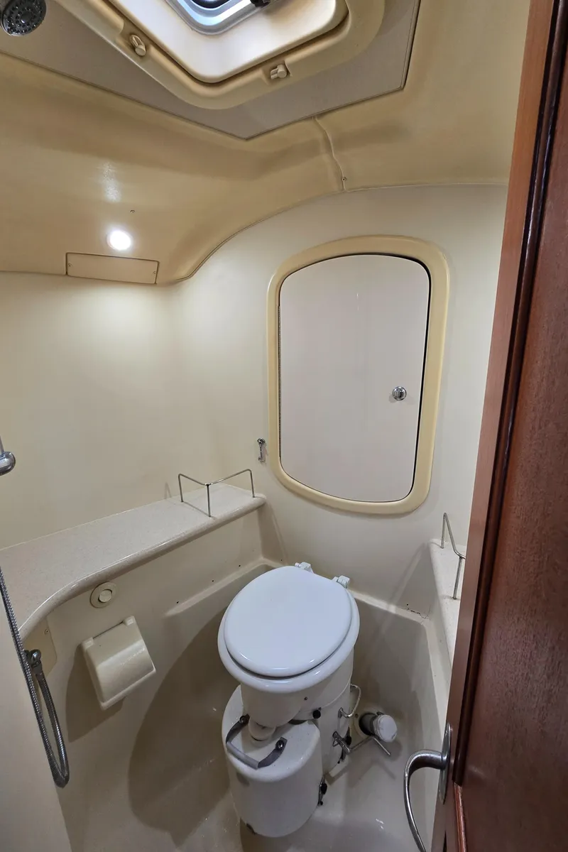 Slide: The Image of Compact bathroom in 2004 Hunter 41 AC sailboat with toilet and skylight. - 45