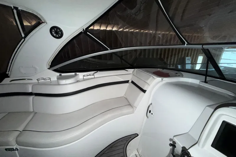 Slide: The Image of 2018 Rinker EX 320 boat interior with sleek seating and modern design. - 12