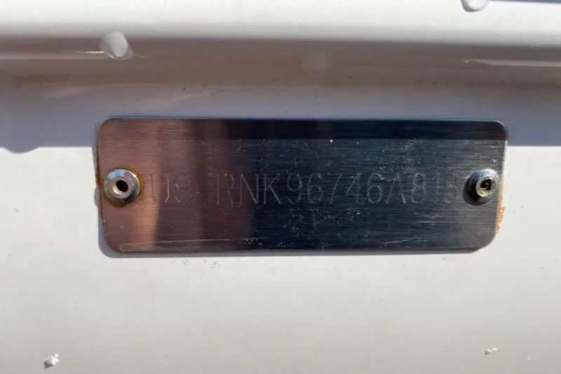 Slide: The Image of 2018 Rinker EX 320 boat hull identification number plate. - 43