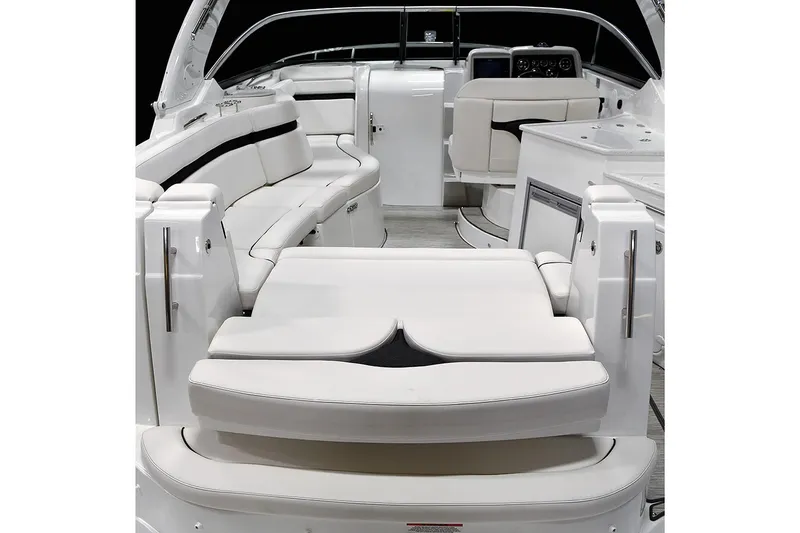 Slide: The Image of Manufacturer Provided Image: 2018 Rinker EX 320 boat interior with white leather seating and modern design. - 6
