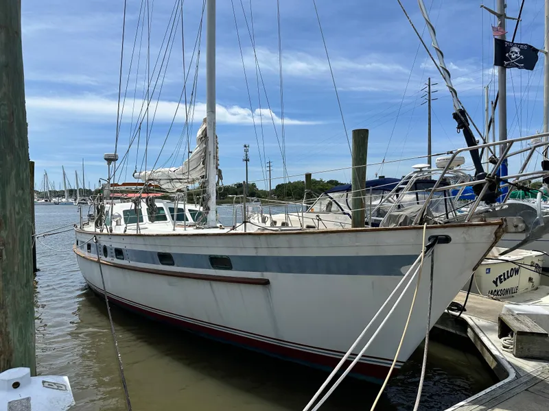 Slide: The Image of 1982 Pan Oceanic 43 sailboat docked at marina under clear blue sky. - 1
