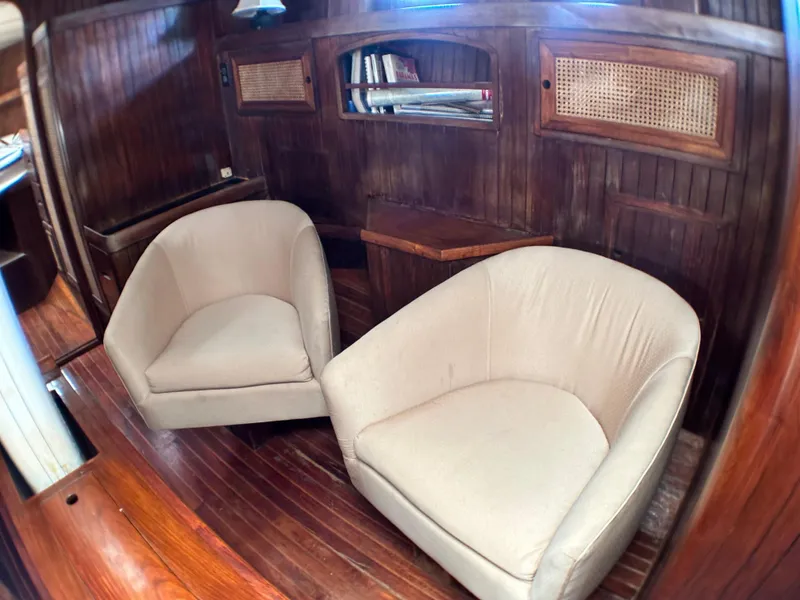Slide: The Image of Interior of 1982 Pan Oceanic 43 yacht with cozy seating and wooden paneling. - 20