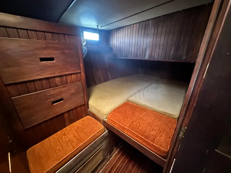 Slide: The Image of Cozy cabin interior of 1982 Pan Oceanic 43 sailboat with wooden furnishings. - 23