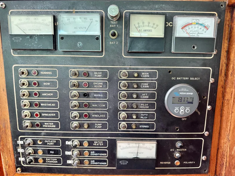 Slide: The Image of Electrical control panel of a 1982 Pan Oceanic 43 boat with gauges and switches. - 30
