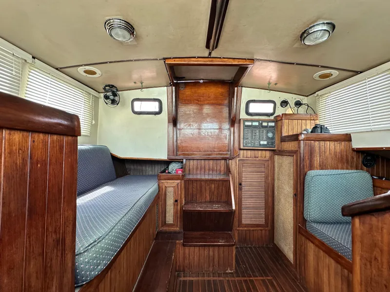 Slide: The Image of Interior of 1982 Pan Oceanic 43 sailboat with wooden furnishings and seating. - 8