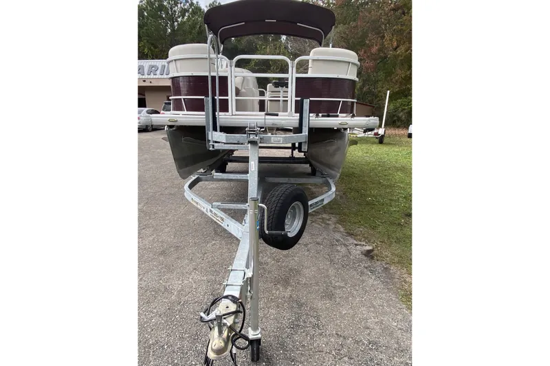Slide: The Image of 2020 Godfrey 180 SR pontoon boat on trailer, parked outdoors. - 5