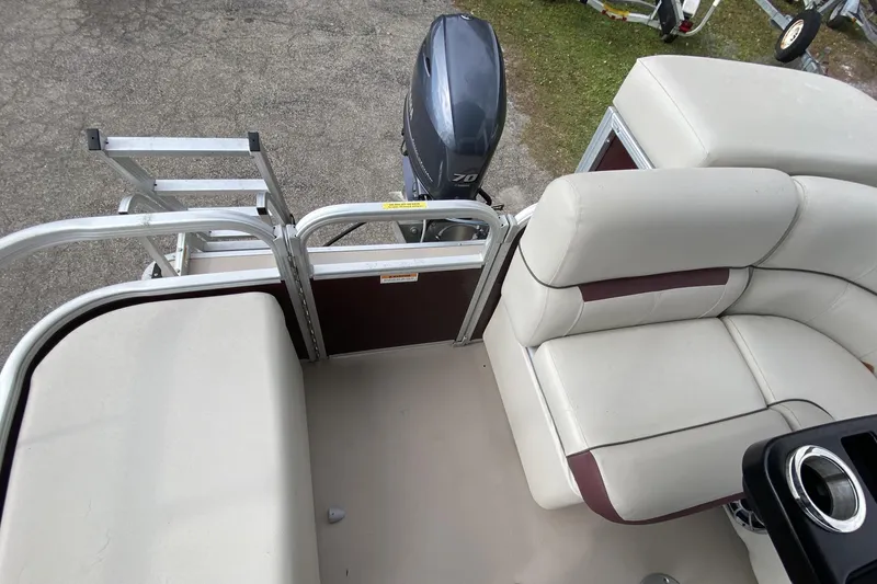 Slide: The Image of 2020 Godfrey 180 SR boat interior with seating and outboard motor. - 7