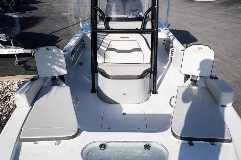 Slide: The Image of 2026 Sea Pro 250 Bay boat interior with seating and storage compartments. - 19