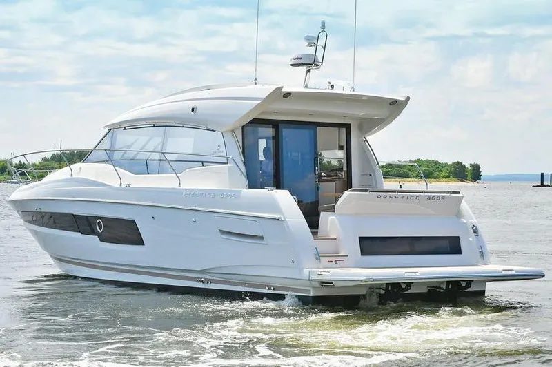 Slide: The Image of 2020 Prestige 460 yacht cruising on a calm waterway. - 1