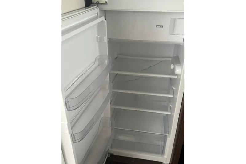 Slide: The Image of Empty Prestige 460 refrigerator, 2020 model, with open door and multiple shelves. - 14