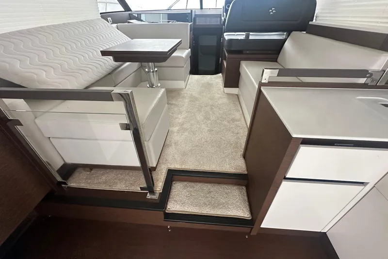 Slide: The Image of Interior of 2020 Prestige 460 yacht with modern seating and table arrangement. - 19