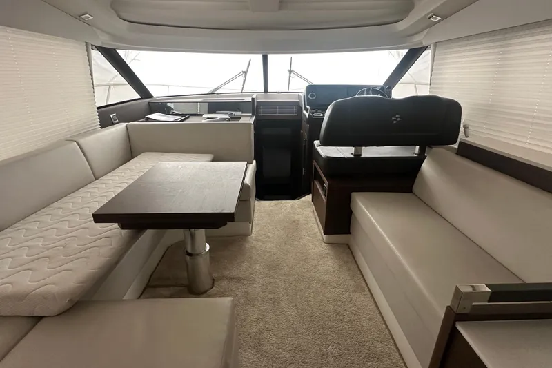 Slide: The Image of Luxurious interior of a 2020 Prestige 460 yacht with elegant seating and helm station. - 23