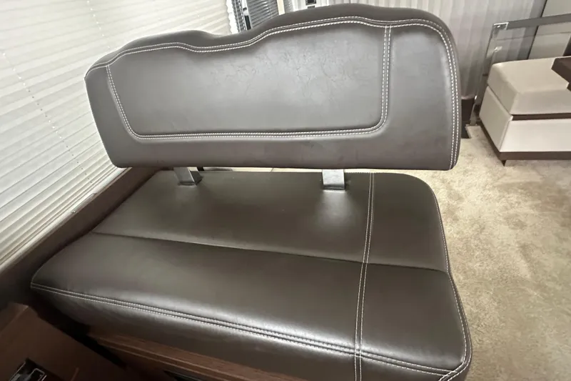 Slide: The Image of Luxurious leather seating in a 2020 Prestige 460 yacht interior. - 27