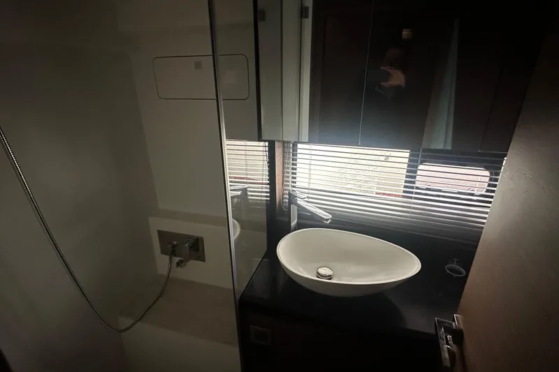 Slide: The Image of Modern bathroom interior of 2020 Prestige 460 yacht with sleek sink and mirror. - 33