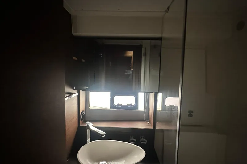 Slide: The Image of Modern bathroom interior of 2020 Prestige 460 yacht with sleek sink and window. - 35