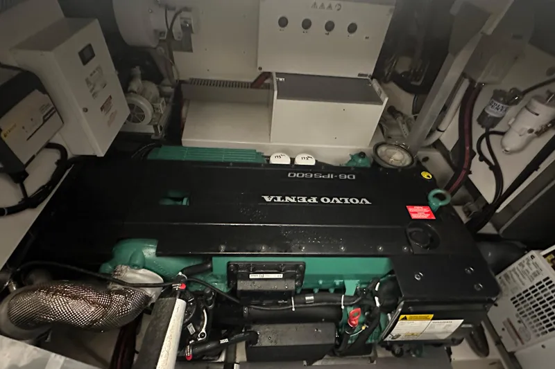 Slide: The Image of Engine room of a 2020 Prestige 460 yacht featuring a Volvo Penta engine. - 36