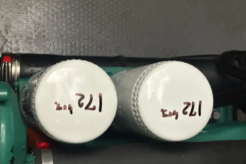 Slide: The Image of Close-up of two white filters labeled "121" on a Prestige 460, 2020 model. - 38