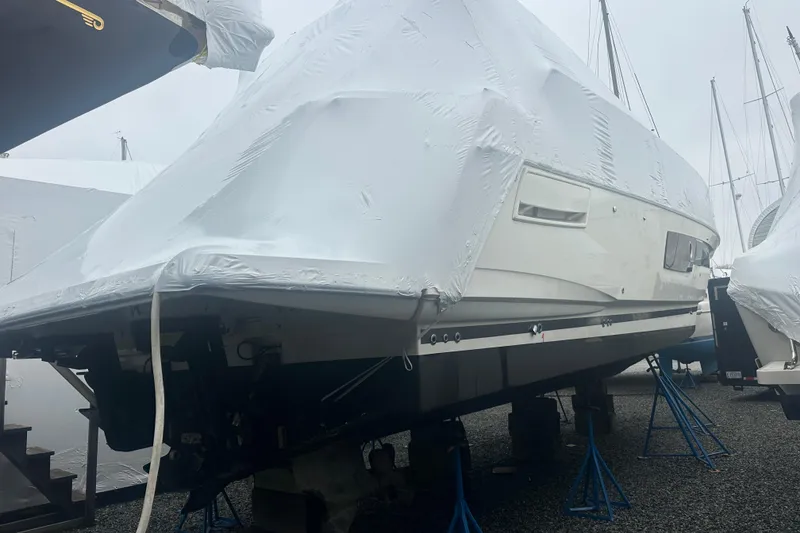 Slide: The Image of Covered 2020 Prestige 460 yacht on stands in a boatyard. - 4