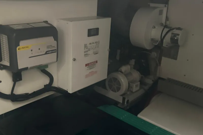 Slide: The Image of Electrical components inside a 2020 Prestige 460 yacht, featuring a Cristec charger. - 43