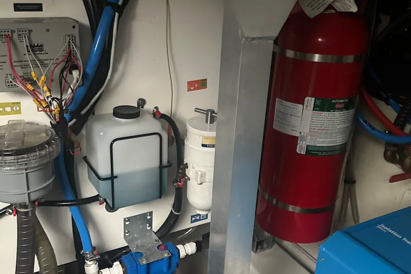 Slide: The Image of Engine room of 2020 Prestige 460 yacht with fire extinguisher and wiring. - 45