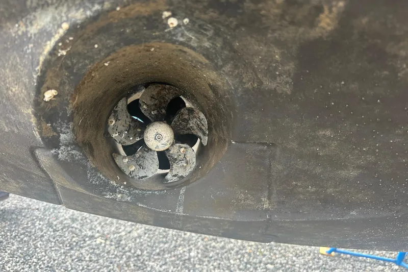 Slide: The Image of Close-up of a 2020 Prestige 460 boat's thruster, showing marine growth. - 48