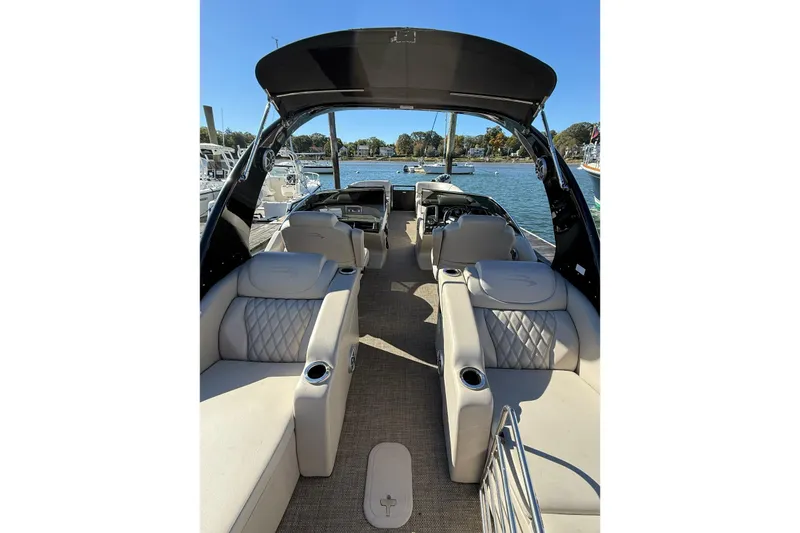 Slide: The Image of 2015 Bennington 2874 QCW boat interior with luxurious seating and open water view. - 4