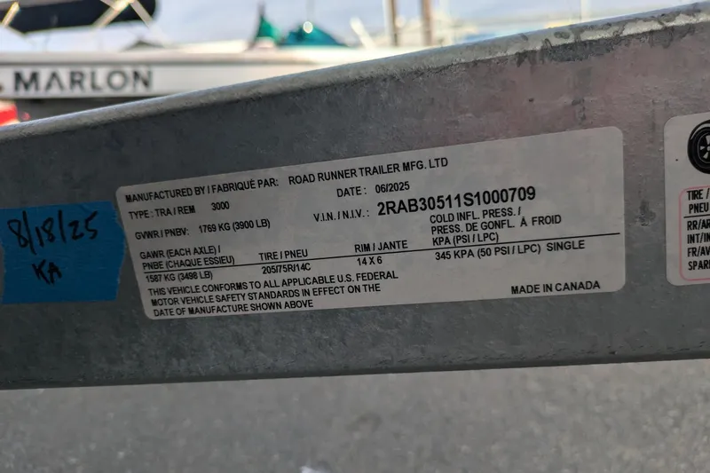 Slide: The Image of Trailer label with specifications, including VIN and tire details, for a 2013 Bayliner 185 Bowrider. - 18