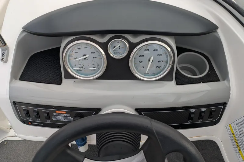 Slide: The Image of Dashboard of 2013 Bayliner 185 Bowrider boat with gauges and controls. - 9