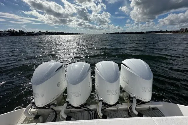 Slide: The Image of Four powerful outboard engines on a 2016 Everglades 435 Center Console boat. - 11
