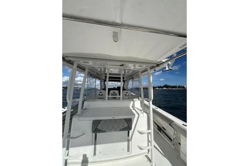 Slide: The Image of 2016 Everglades 435 Center Console boat interior with ocean view. - 14