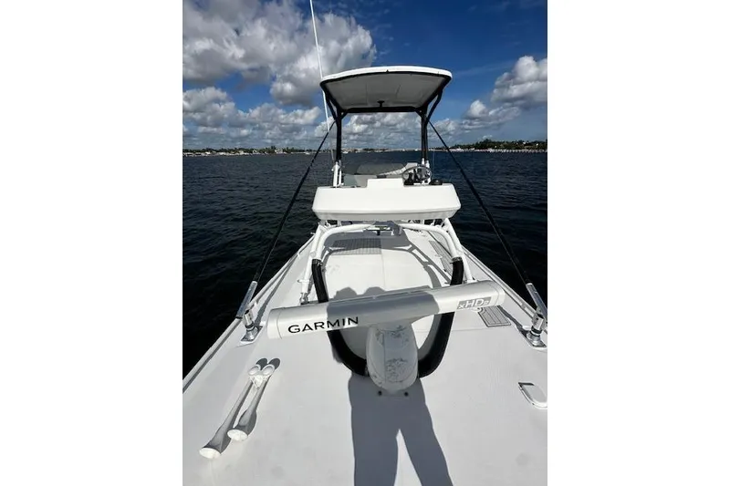 Slide: The Image of 2016 Everglades 435 Center Console boat on water, featuring Garmin equipment. - 19