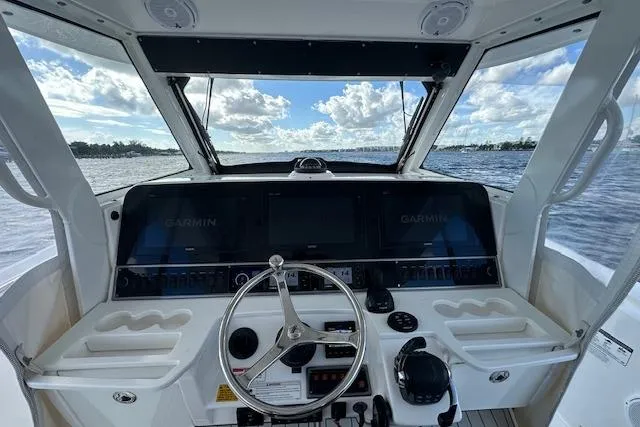 Slide: The Image of Cockpit view of 2016 Everglades 435 Center Console boat with Garmin navigation system. - 24