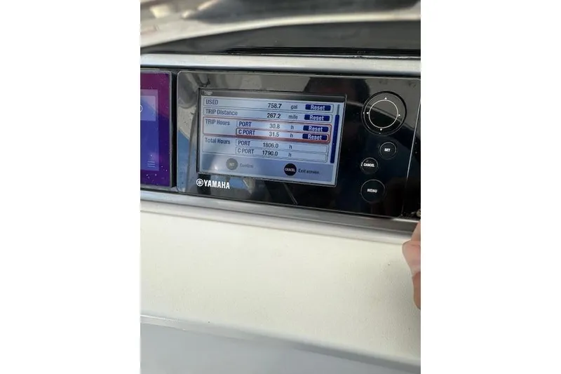 Slide: The Image of Yamaha display on 2016 Everglades 435 Center Console showing trip data and engine hours. - 28