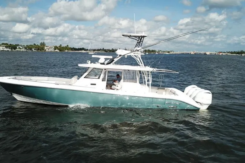 Slide: The Image of 2016 Everglades 435 Center Console boat cruising on a sunny day. - 3
