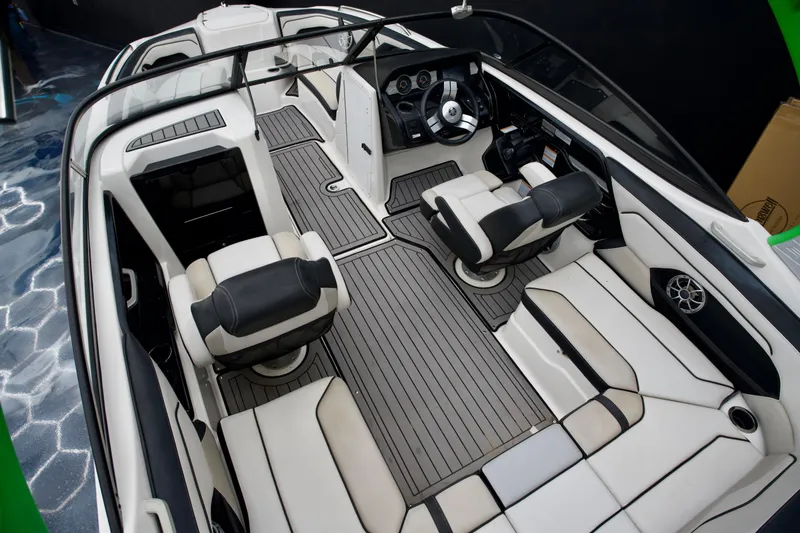 Slide: The Image of 2018 Yamaha Boats 212X interior with sleek seating and modern dashboard design. - 10