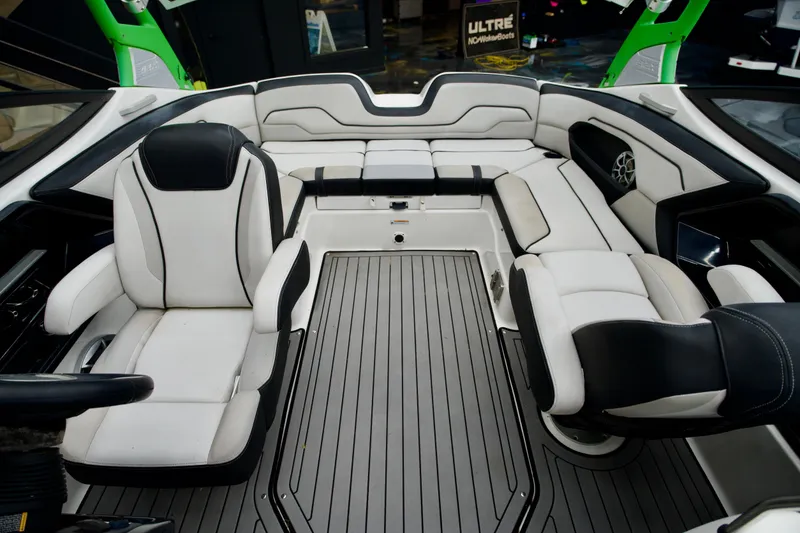 Slide: The Image of 2018 Yamaha Boats 212X interior with sleek seating and modern design. - 8