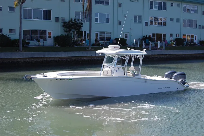 Slide: The Image of 2020 Cape Horn 31T boat cruising near waterfront buildings. - 10