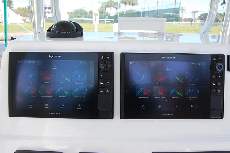 Slide: The Image of Dual Raymarine displays on 2020 Cape Horn 31T boat dashboard. - 14