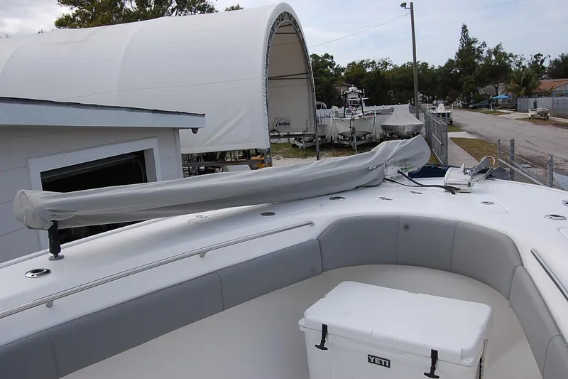 Slide: The Image of 2020 Cape Horn 31T boat deck with covered equipment and Yeti cooler. - 19