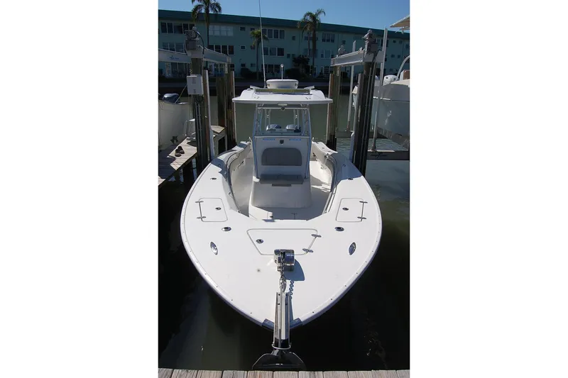 Slide: The Image of 2020 Cape Horn 31T boat docked, front view, in a marina setting. - 3