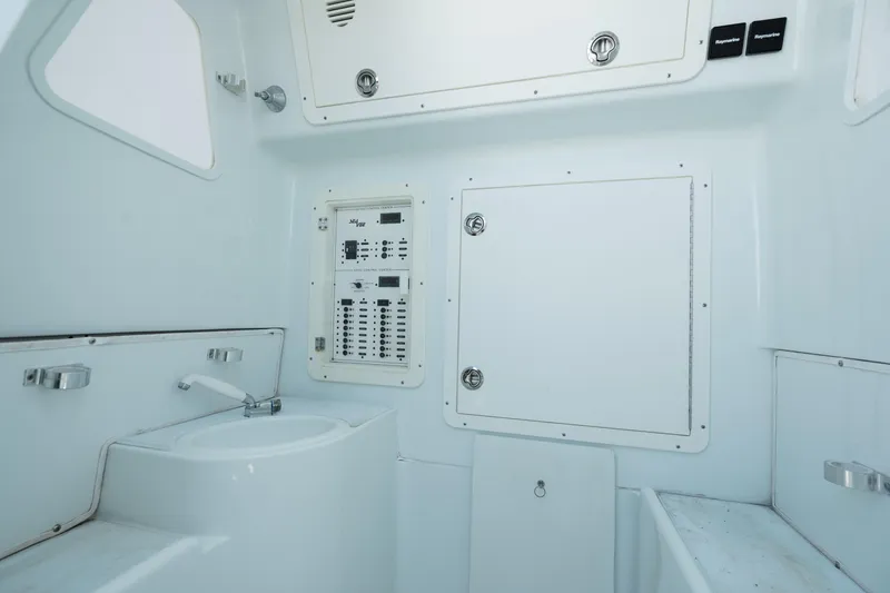 Slide: The Image of 2017 SeaVee 390Z boat interior with control panel and sink. - 10