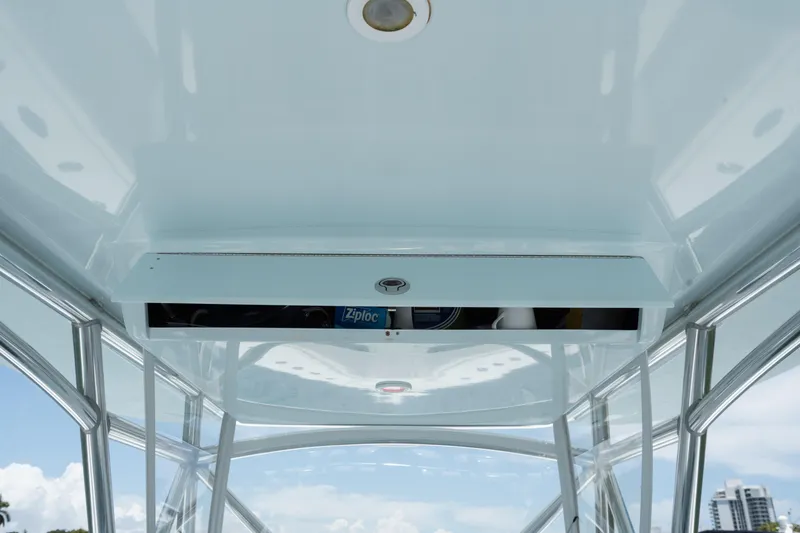 Slide: The Image of 2017 SeaVee 390Z boat interior with storage compartment and clear sky view. - 21