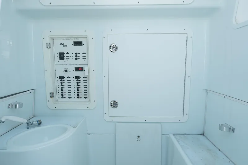 Slide: The Image of 2017 SeaVee 390Z boat control panel and sink area. - 25