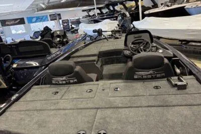 Slide: The Image of 2026 Skeeter ZX150 boat interior with dual seats and steering console. - 3