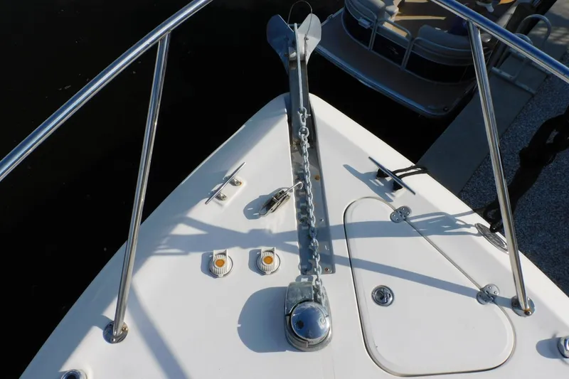 Slide: The Image of Bow of 2006 Monterey 302 Cruiser with anchor and railing details. - 24