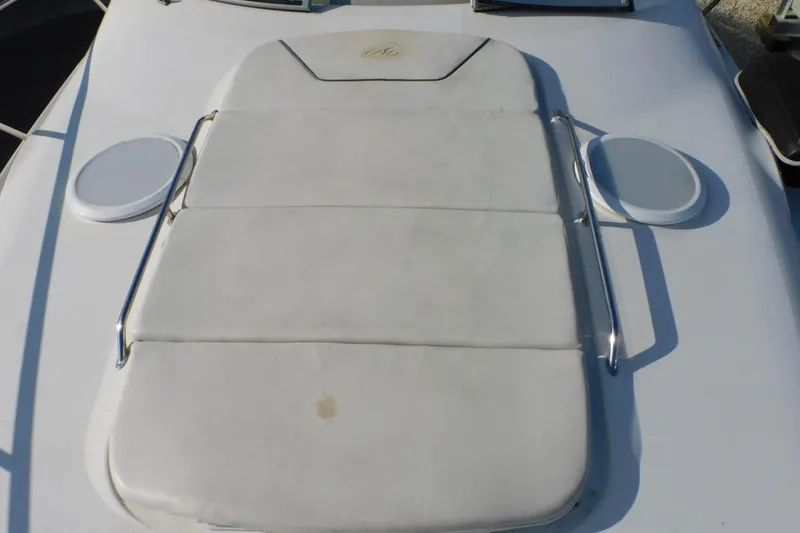 Slide: The Image of 2006 Monterey 302 Cruiser deck with cushioned sunpad and stainless steel rails. - 25