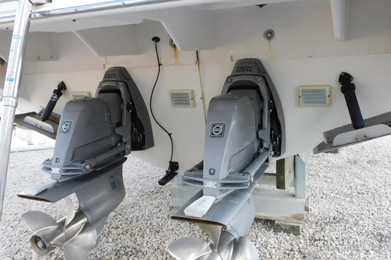 Slide: The Image of 2006 Monterey 302 Cruiser with dual Volvo Penta outdrives on gravel surface. - 34