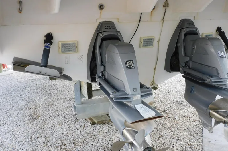 Slide: The Image of 2006 Monterey 302 Cruiser with Volvo Penta outdrives on gravel surface. - 35