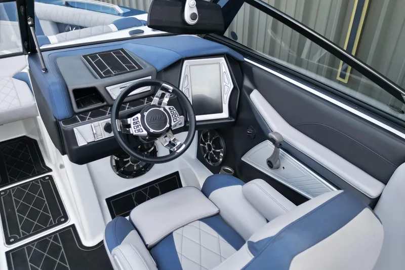 Slide: The Image of 2019 Tigé ZX1 boat interior with modern dashboard and steering wheel design. - 9