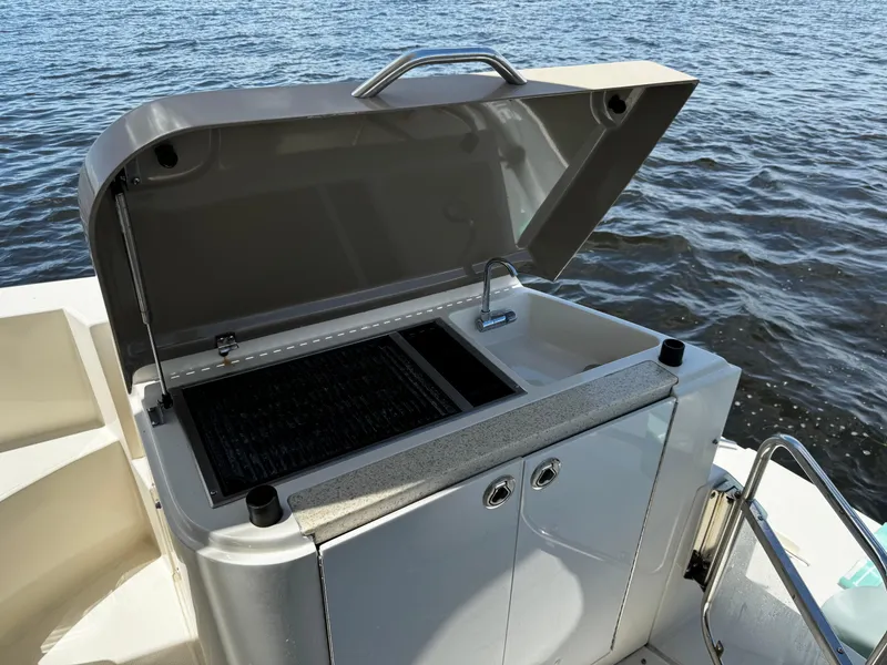 Slide: The Image of Outdoor grill on a 2017 Carver C40 yacht, open lid, near water. - 47